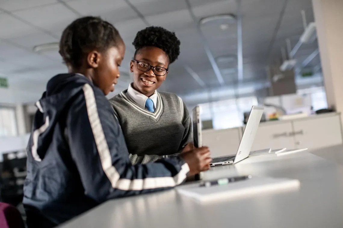 Tow girls working on a laptop | Miss.Africa Digital